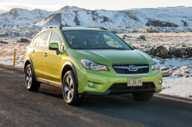 2014 Subaru XV Crosstrek Hybrid Green Front Three Quarters In Motion 04