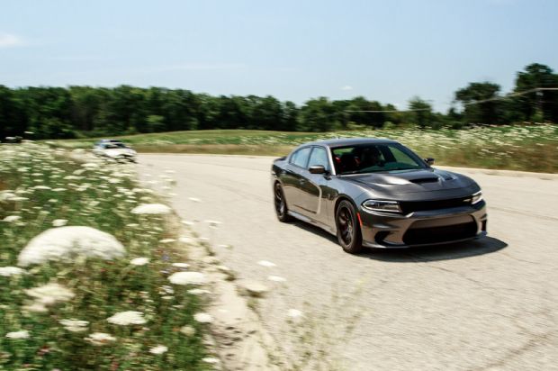 2015 Dodge Charger SRT Hellcat Front Three Quarter In Motion 01