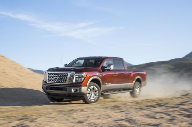 2016 Nissan Titan XD 4x4 Front Three Quarter In Motion 04