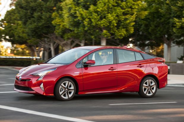 2016 Toyota Prius Four Touring Front Three Quarter In Motion 01