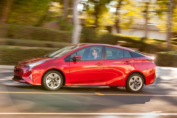 2016 Toyota Prius Four Touring Side Profile In Motion 03
