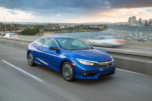 2016 Honda Civic Touring Coupe Front Three Quarter In Motion 03