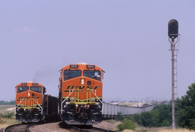 Two BNSF locomotives hauling coal trains meet near Wichita Falls, Texas