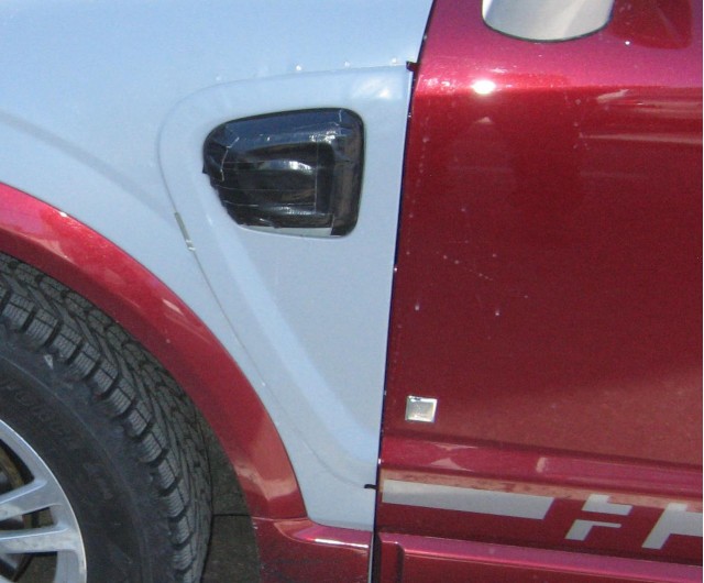 detail of spy shot showing GM Two-Mode Plug-In Hybrid being tested in Saturn Vue mule detail of spy shot showing GM Two-Mode Plug-In Hybrid being tested in Saturn Vue mule