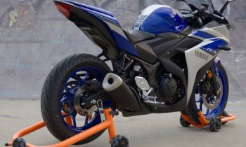 Omni-directional stand lets you easily move your motorcycle around the garage