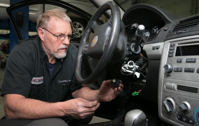 Gary Pittam performs recall service on a Chevrolet Cobalt Thursday, April 17, 2014, at Al Serra Chevrolet in Grand Blanc, Michigan. (Photo by John F. Martin for General Motors)
