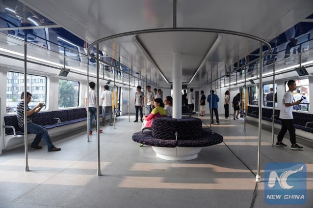 Transit Elevated Bus (TEB) - Image via China Xinhua News Transit Elevated Bus (TEB) - Image via China Xinhua News