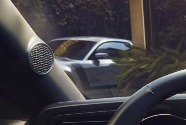 2018 Ford Mustang press shot with fifth-generation Mustang Boss 302 in background