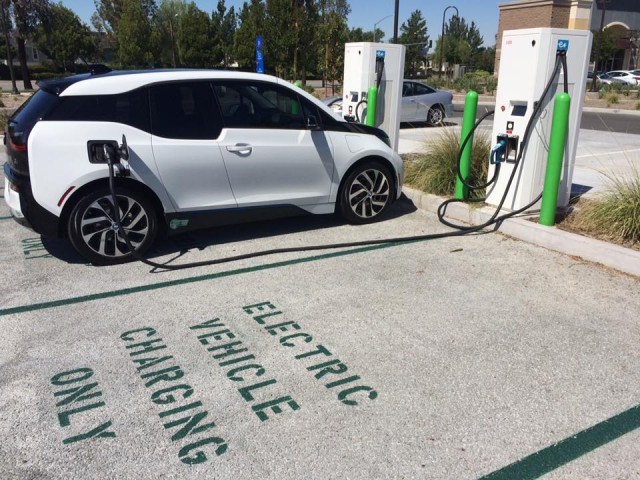 BMW i3 electric car charging in 'EV Charging Only' space, Santa Clarita, CA  [photo: Steve J. Myung]