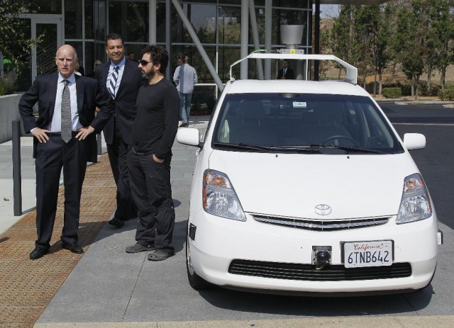 CA Governor Jerry Brown, State Sen. Alex Padilla, and Google's Sergey Brin beside an autonomous car