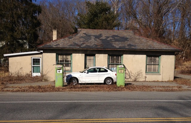 BMW ActiveE electric car in front of old gas pumps, Belvidere, NJ [photo: Tom Moloughney]