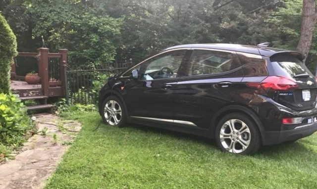 Reader David Edwards' Chevy Bolt EV, charing on a friend's lawn in Maryland