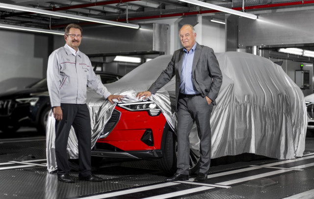 Audi management inspect first e-tron electric SUV off the line at plant in Brussels, Belgium