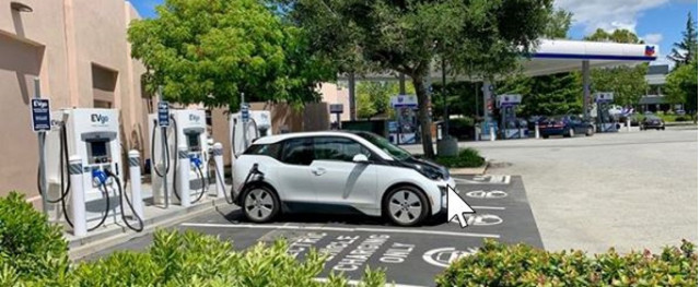 Chevrolet Bolt EV charging at EVgo fast chargers at Chevron station, Menlo Park, California