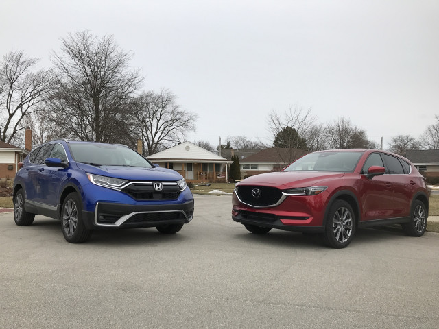 The 2020 Honda CR-V (blue) and 2020 Mazda CX-5 (red) compete in the compact crossover class. 