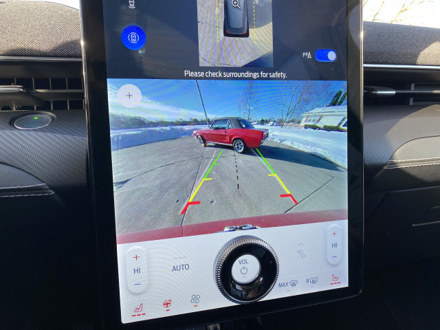 2021 Ford Mustang Mach-E and 1967 Ford Mustang coupe