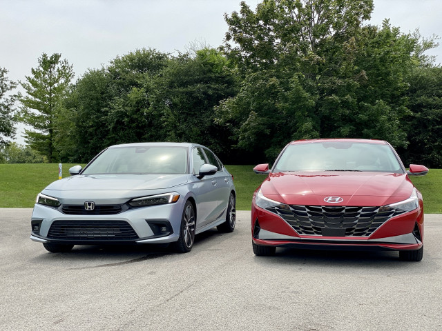 2022 Honda Civic Touring, blue, and 2021 Hyundai Elantra SEL, red 2022 Honda Civic Touring, blue, and 2021 Hyundai Elantra SEL, red