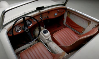 Jay Leno shows off his unrestored 1959 Austin-Healey Sprite