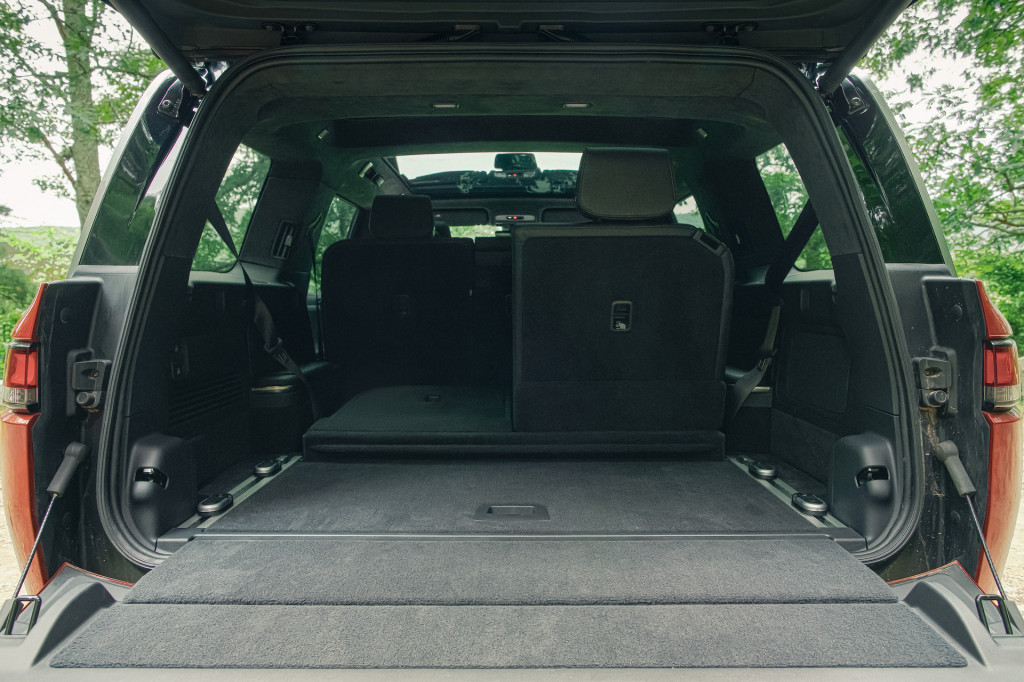 Rivian outfits the R1S's cabin with sustainable materials, plenty of technology, and some cool extras.