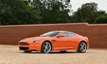 Collection of 8 orange Aston Martins head to the auction
